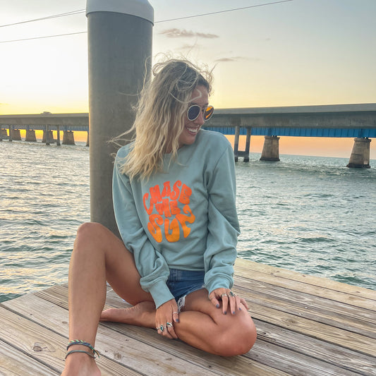 Chase The Sun crewneck sweatshirt in the color sea mist from Wandering Waves Surf Company. Made from sustainable materials and 100% organic cotton